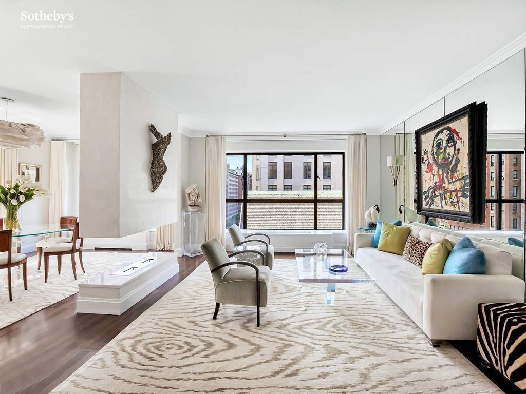 Living room — alternate angle showing the corner-residence light advantage and the open-plan flow to the dining area