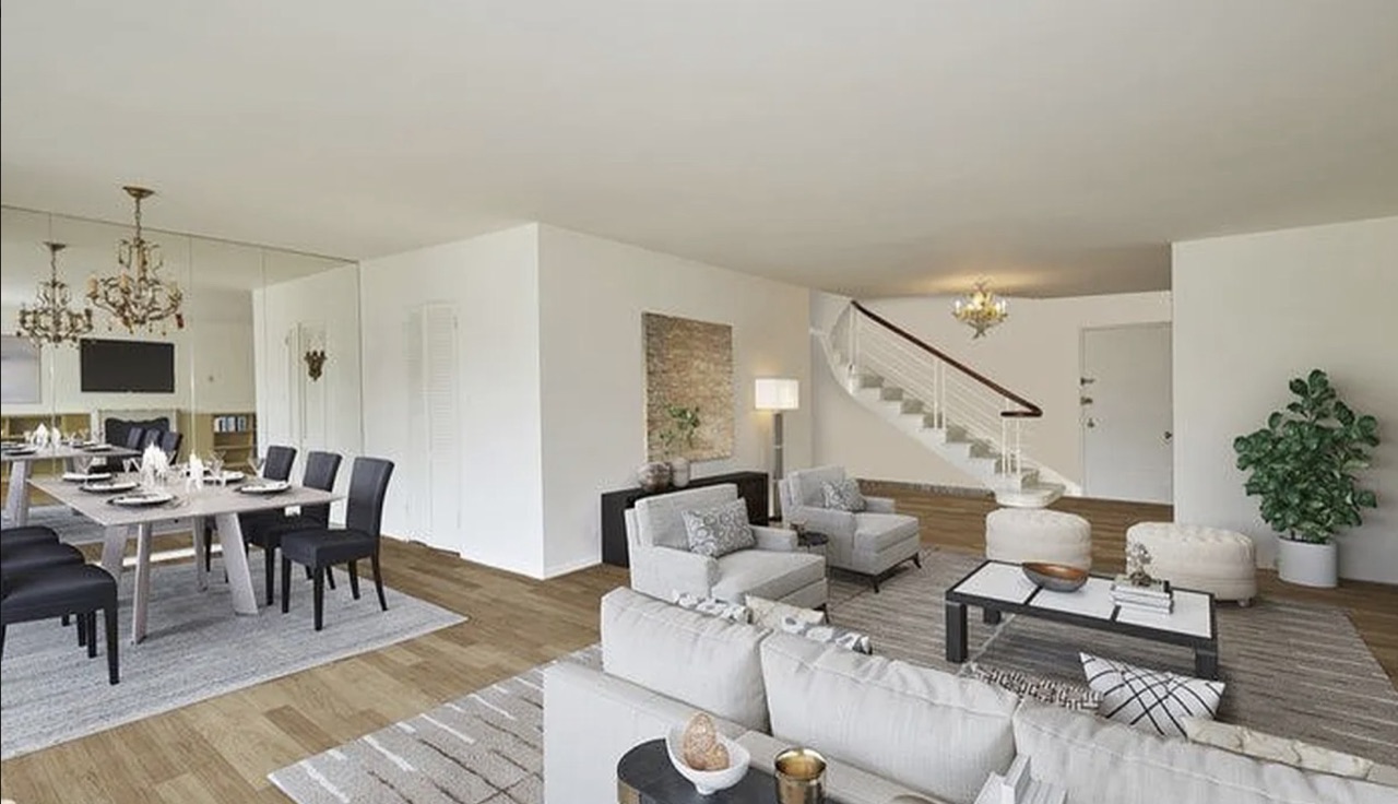 8 East 83rd Street — the duplex living-and-dining with the staircase to the upper level