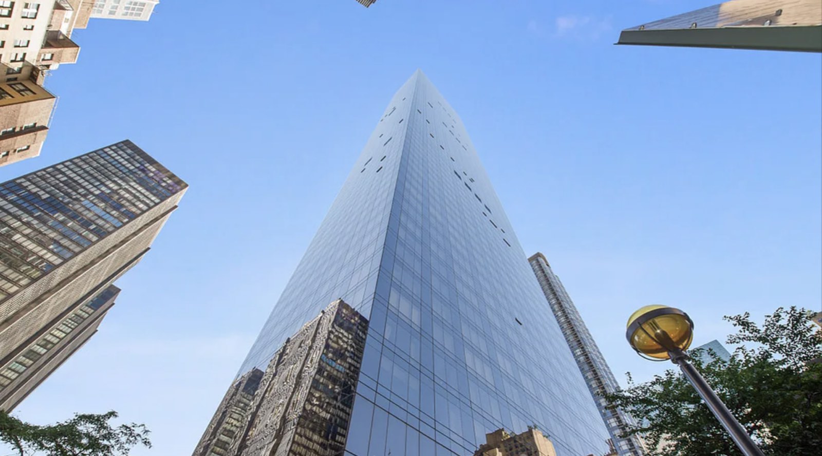 845 United Nations Plaza from the street — looking up the dark bronze-glass tower
