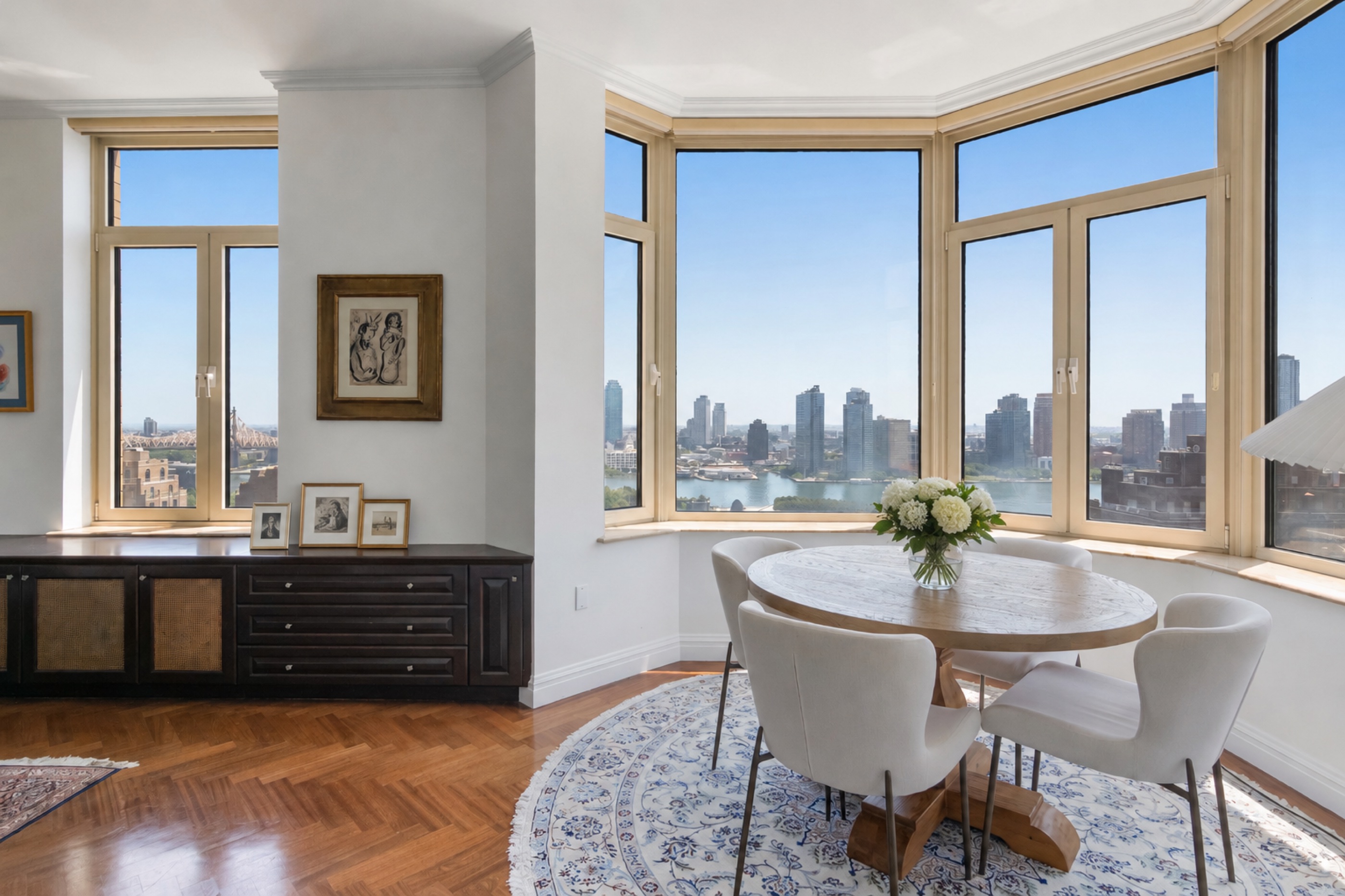 The dining area, with windows on two sides and the river view beyond